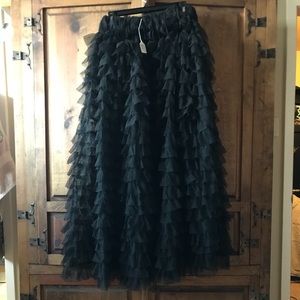Long tulle ruffle skirt.